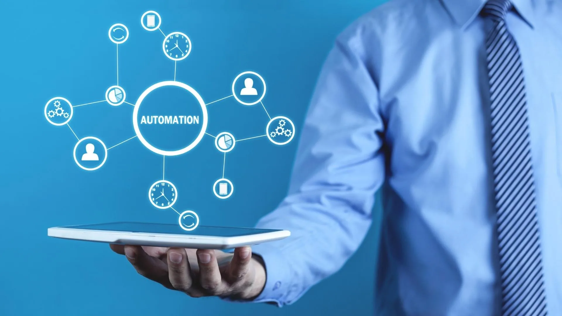 Man holding a table with the word Automation displaying