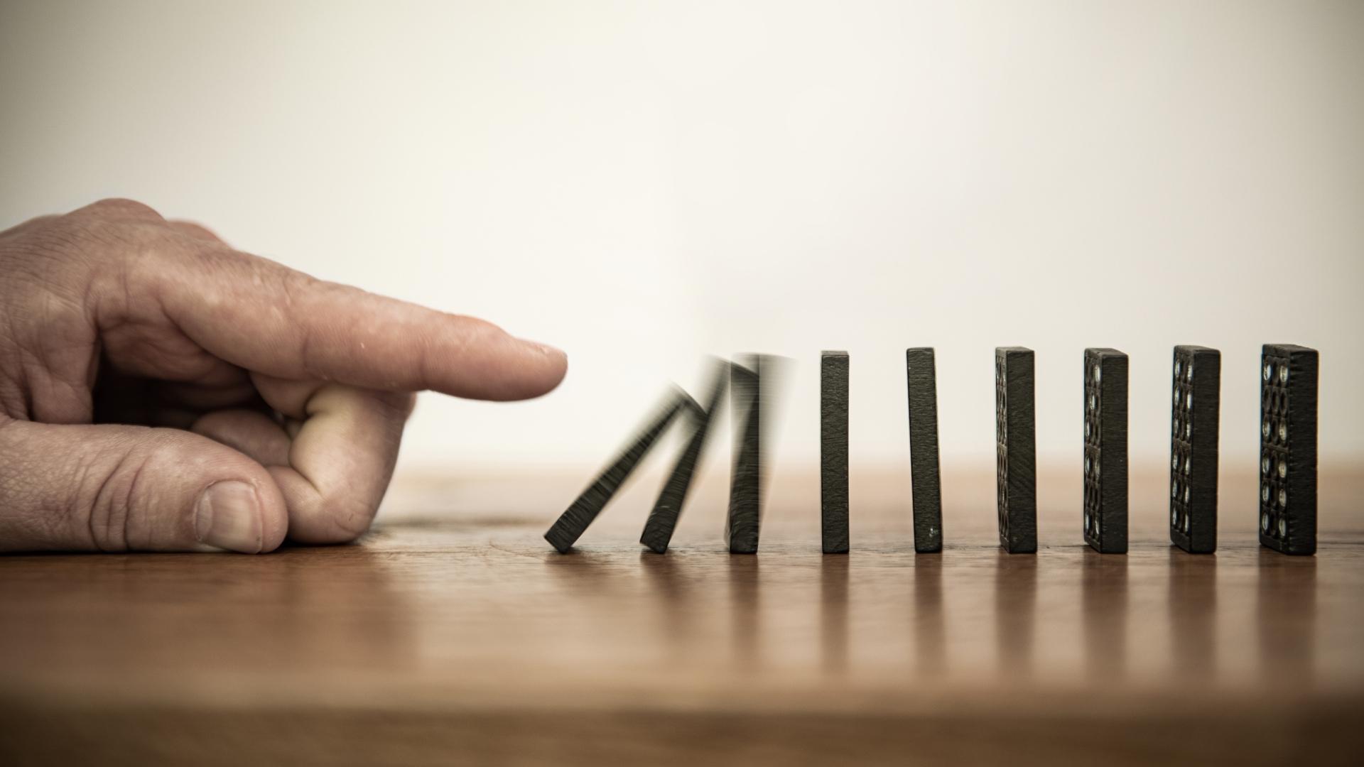 Domino pieces being toppled